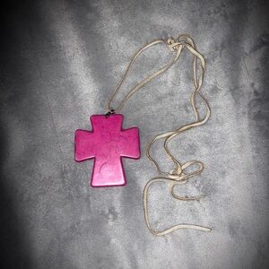 Pink cross decoration.